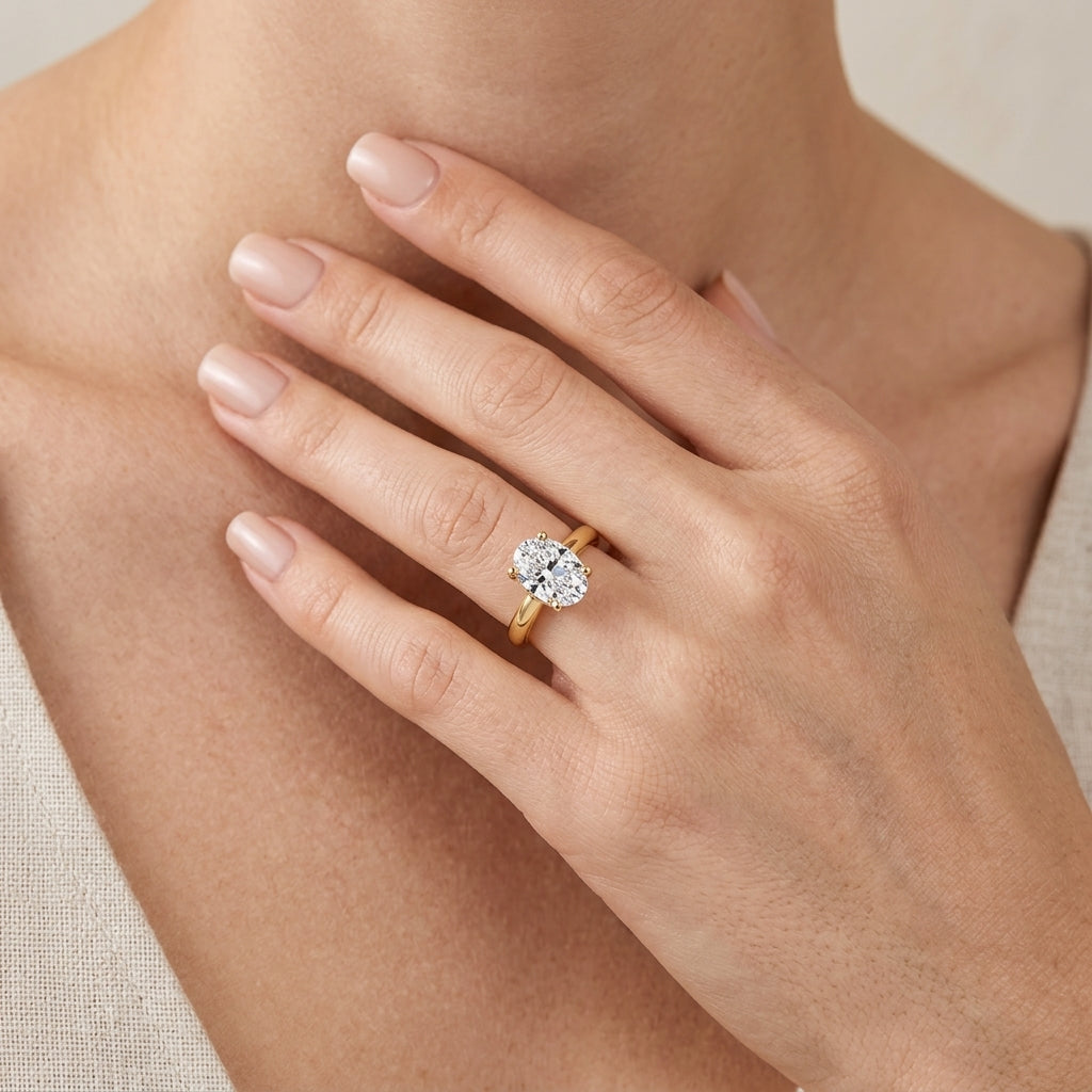 Gabriel & Co. Villa - 14K Yellow Gold Half Bezel Oval Diamond Engagement Ring 10.5X7 1/10CTW SEMI - worn lifestyle photo