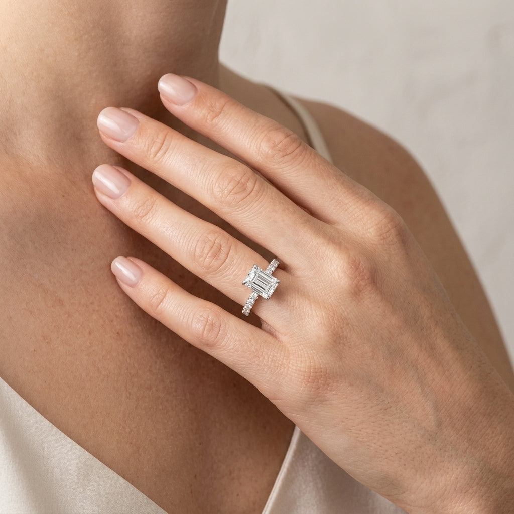 Prong Set Emerald Cut Hidden Halo Engagement Ring - worn lifestyle photo