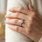 Round Hidden Halo Engagement Ring - worn lifestyle photo