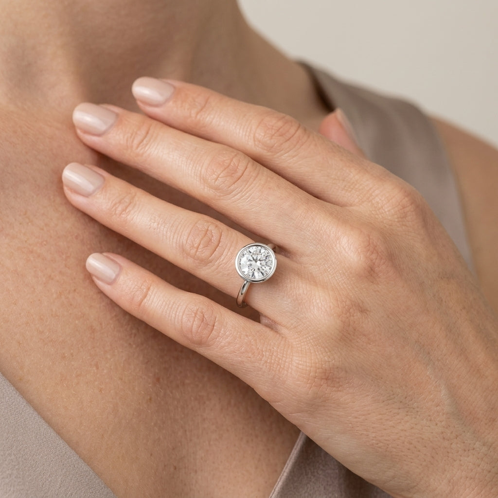 Solitaire Bezel Set Round Engagement Ring - worn lifestyle photo