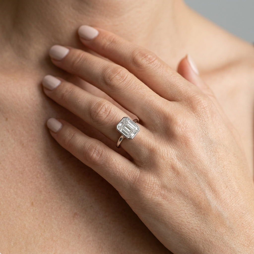 Bezel Set Emerald Cut Solitaire Engagement RIng - worn lifestyle photo