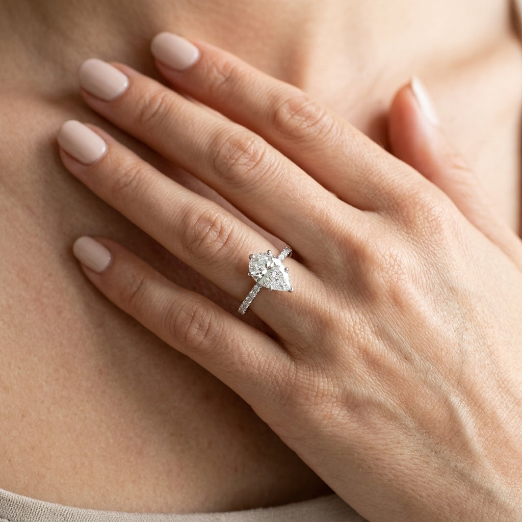 Hidden Halo Pear Shape Engagement Rings - worn lifestyle photo