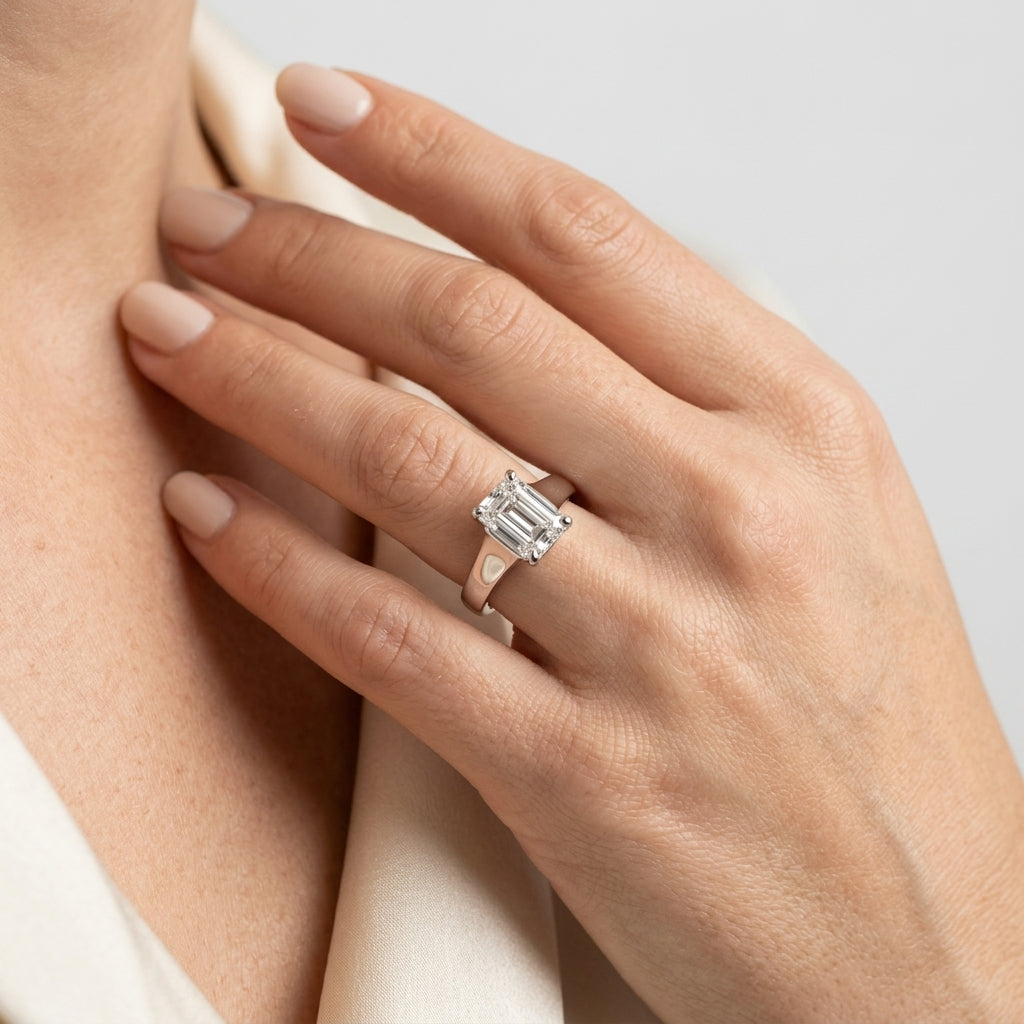 Solitaire Trellis Emerald Cut Engagement Ring - worn lifestyle photo
