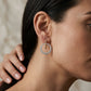 Gabriel & Co. 14K White-Yellow Gold Bujukan Diamond Circle Huggies 1.06CTW - worn lifestyle photo