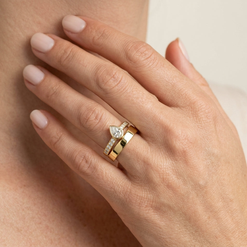 3/4 Ctw Split Twin Row Bezel Set Pear and Round Cut Diamond Fashion Ring in 14K Yellow Gold - worn lifestyle photo