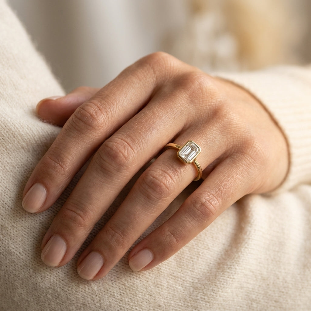 1/6 Ctw Petite Bezel Set Emerald Cut Diamond Fashion Ring in 10K Yellow Gold - worn lifestyle photo