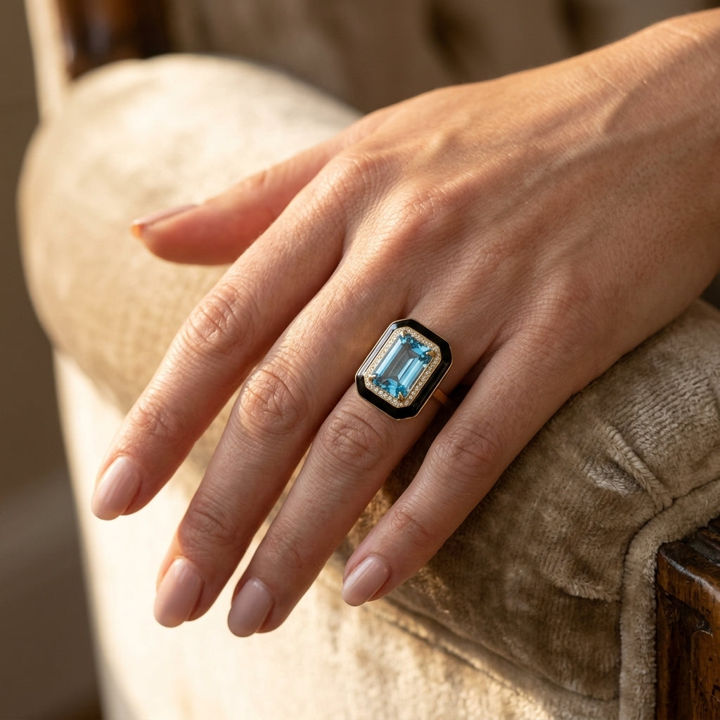 14X10 MM Evoque Gemstones Emerald Shape Blue Topaz and 1/5 Ctw Round Cut Diamond Halo & Black Enamel Border Semi-Precious Ring in 14K Yellow Gold - worn lifestyle photo