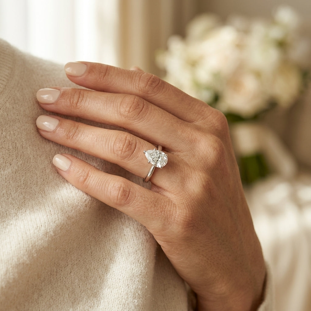 Pear Shape Solitaire Engagement Rings - worn lifestyle photo