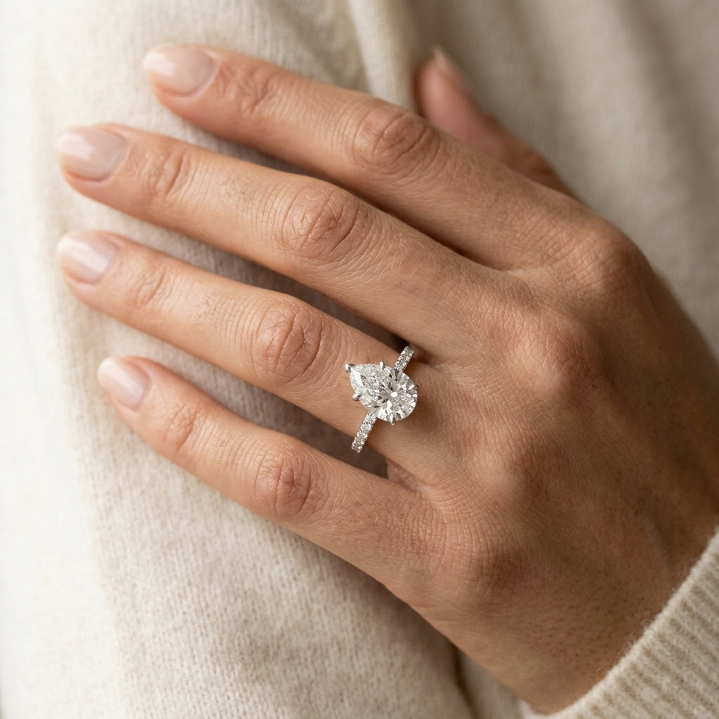 Hidden Halo Pear Shape Engagement Rings - worn lifestyle photo