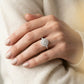 Round Halo Prong Engagement Ring - worn lifestyle photo