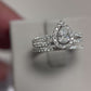 Romantic 14K white gold pear halo wedding set with .25ct center and 1ct total diamonds. Elegant sparkle and timeless beauty