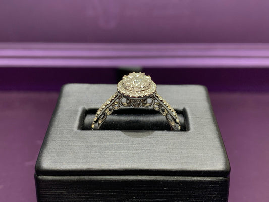 14kt white Gold with 3/4ctw round diamonds with two halos and one round solitaire